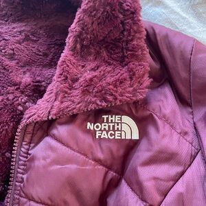 Small burgundy North Face reversible puffy. Softy and glossy.